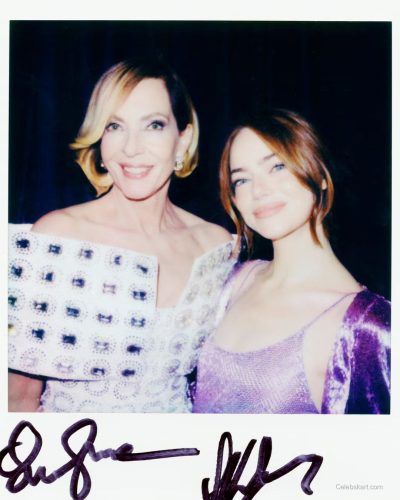 Emma Stone in a purple dress complemented by simple metallic jewelry