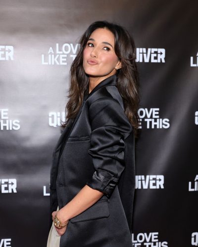 Emmanuelle Chriqui with a black blazer and pointed toe shoes.