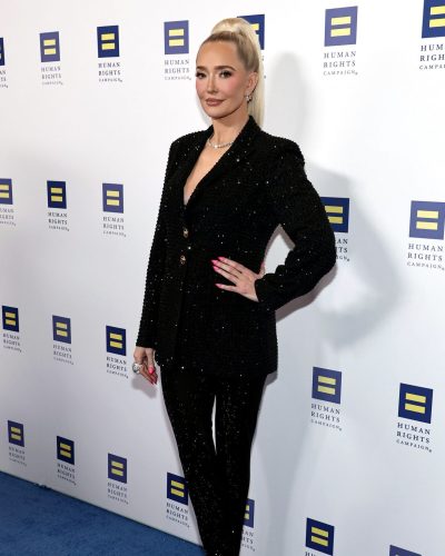Erika Jayne wearing sleek black suit with shimmering sequins.