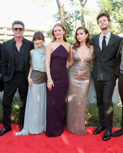 Erin Moriarty body-hugging silver dress with shimmering details