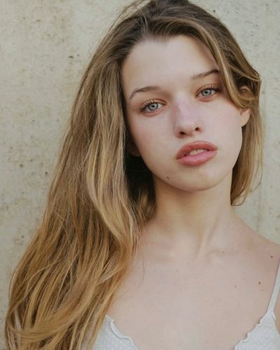 Ever Anderson in breezy beige blouse with cute polka dots