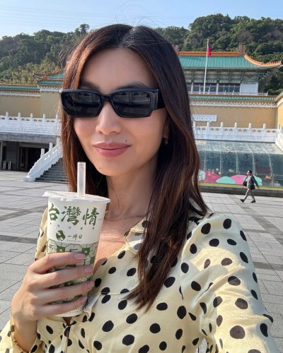 Gemma Chan in black gown with intricate cut-outs.