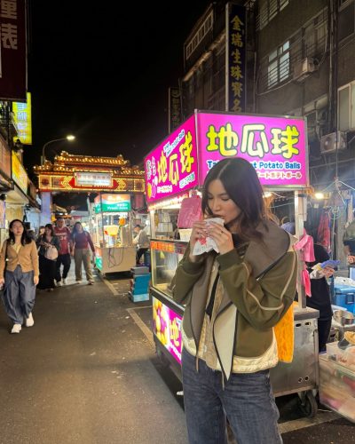 Gemma Chan black gown paired with sleek evening shoes.