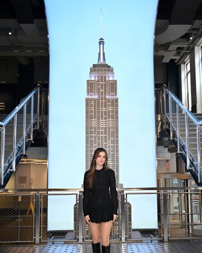 Giorgia Wingham in tailored black mini dress and fashionable knee-high boots