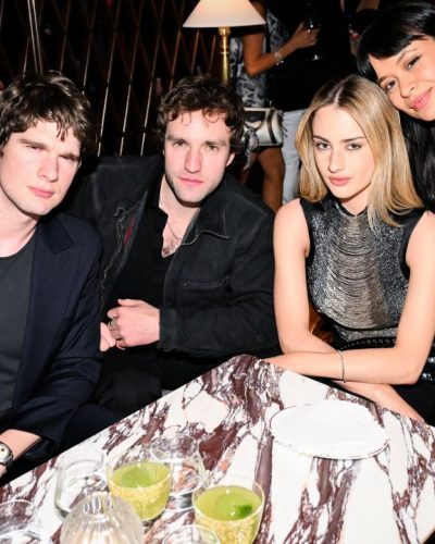 Grace Van Patten modern black dress with polished hair