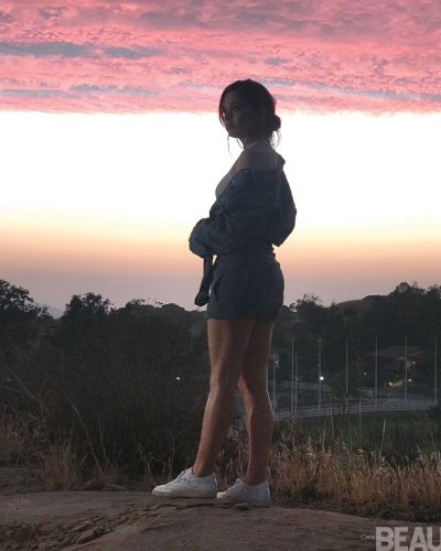 Hailee Steinfeld in black coat