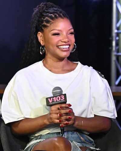 Halle Bailey featuring a white T-shirt and chic jeans.