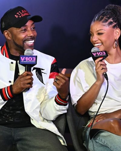 Halle Bailey wearing a white T-shirt and distressed jeans.
