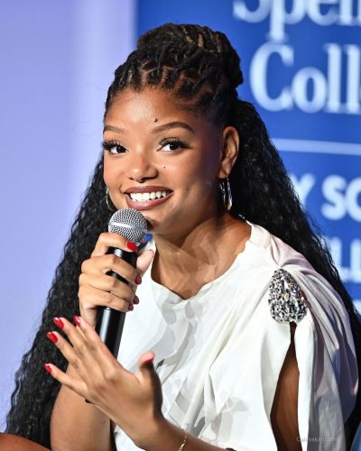 Halle Bailey relaxed tee and trendy ripped jeans combination