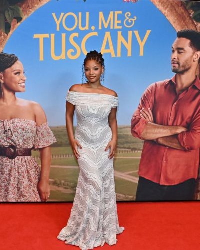 Halle Bailey in off-shoulder textured white dress.