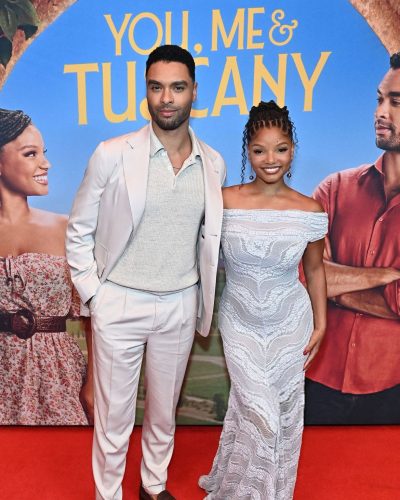 Halle Bailey in a classic off-shoulder white dress.