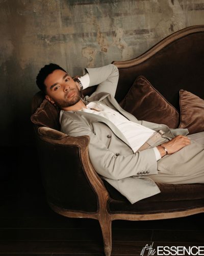 Halle Bailey in a chic white gown featuring unique draping details.