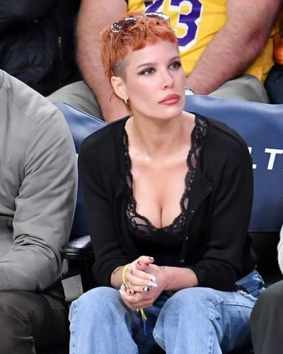Halsey dressed in delicate lace top and black cardigan