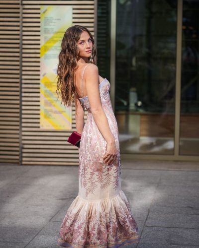 Hanna Porter styled with matching pink accessories and heels.