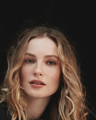 Hannah Dodd in fitted neutral blazer and delicate blouse.