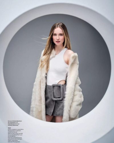 Hannah Dodd with cascading hair and a black long-sleeve dress.