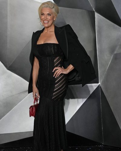 Hannah Waddingham accessorized with shimmering statement earrings.