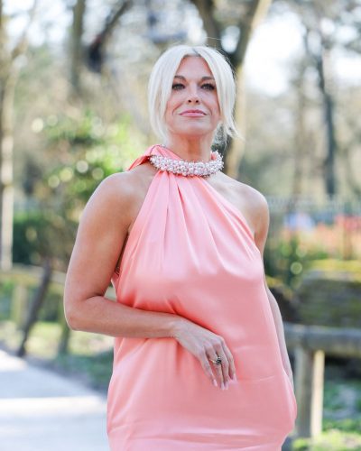 Hannah Waddingham wearing a pastel pink dress with halter design.