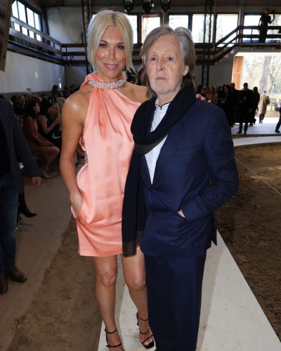 Hannah Waddingham in sophisticated pink halter dress and pearl choker.