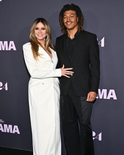 Heidi Klum in tailored white dress with chic button accents