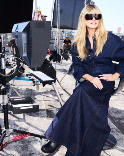 Heidi Klum wearing relaxed-fit denim shirt and chic denim pants.