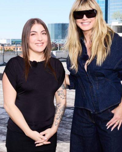 Heidi Klum in modern oversized denim shirt and tailored trousers.