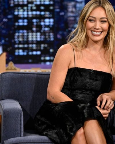 Hilary Duff form-fitting black dress accentuating her figure