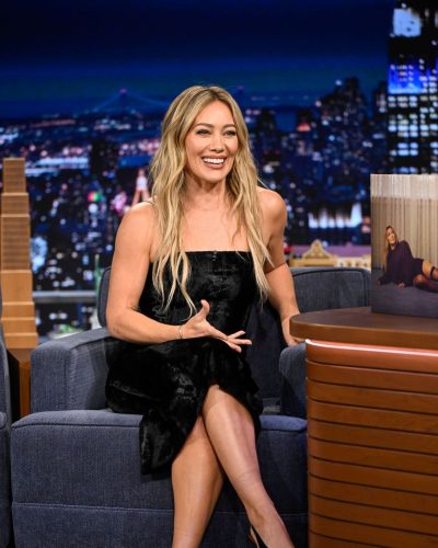 Hilary Duff black dress with curves-hugging design and casual waves