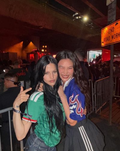 Hoyeon Jung in a blue jersey matched with a black skirt.