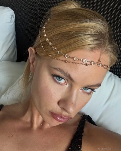 Ilona Arsentieva black fitted dress with delicate lace trim