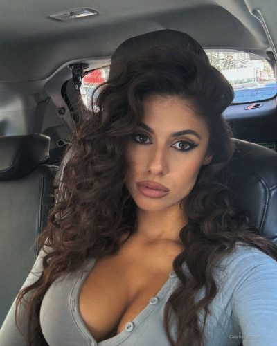 Ines Trocchia in a playful pose with black lingerie.