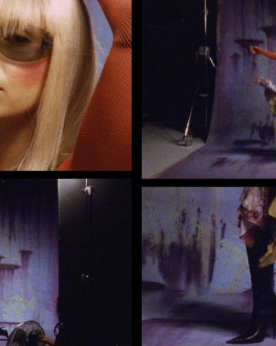 Iris Law in statement earrings and floral skirt ensemble.