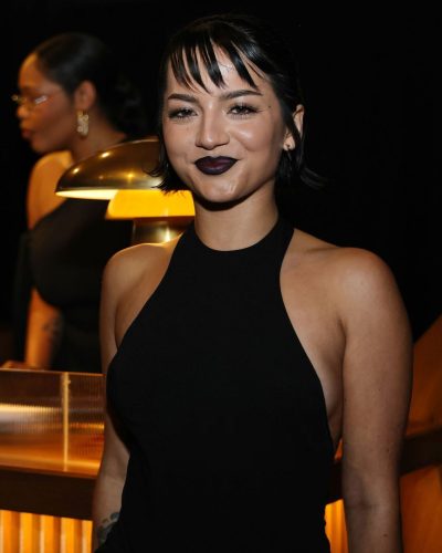 Isabela Merced black gown complemented by a chic hairstyle