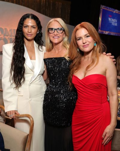 Isla Fisher sleek red gown with draped details