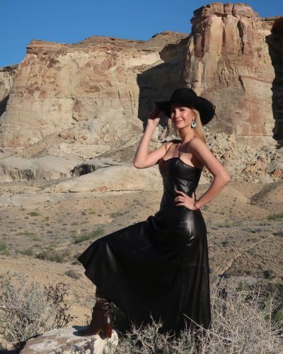 Ivanka Trump in fitted leather dress paired with wide-brim hat