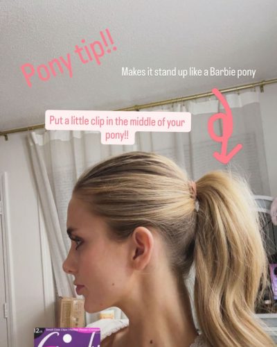 Izzy Darnell in a soft pink dress featuring a flattering silhouette.