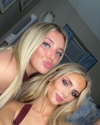 Izzy Darnell wearing a burgundy top with strappy details.