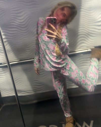 Izzy Darnell wearing pink gown with whimsical rose detail