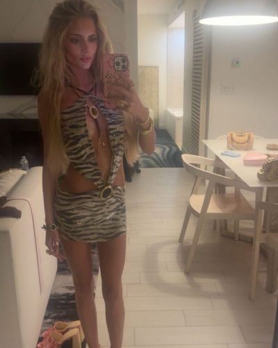 Izzy Darnell in pink dress with soft hues and layers