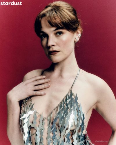 Izzy Meikle-Small in a silver gown with striking light play.