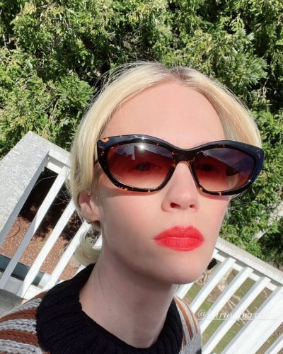 January Jones wearing soft cream cardigan with feminine lace trim