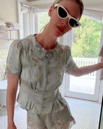 January Jones in casual cream cable-knit cardigan and lace shorts