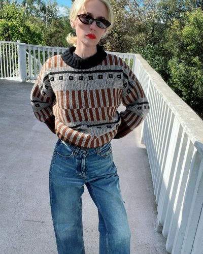 January Jones in soft cream cable-knit cardigan with lace trim