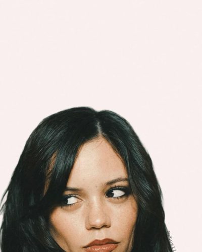 Jenna Ortega sporting a comfortable muted palette top.