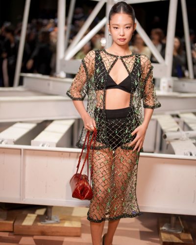 Jennie Kim sheer gown with intricate beadwork and green accents