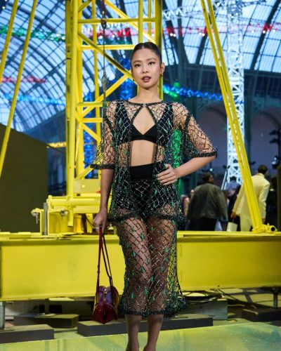 Jennie Kim unique sheer ensemble with black and green elements