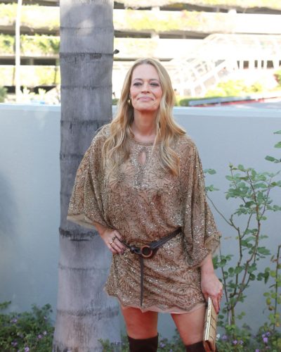 Jeri Ryan in relaxed beige gown featuring intricate beadwork