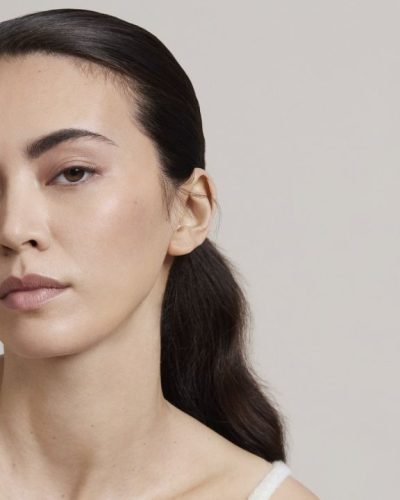 Jessica Henwick striped silk scarf tied around her neck