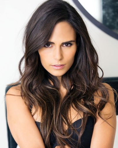 Jordana Brewster in dark bikini bottom accentuating toned physique