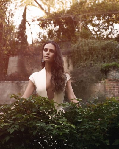 Jordana Brewster in a rich-colored gown with intricate detailing